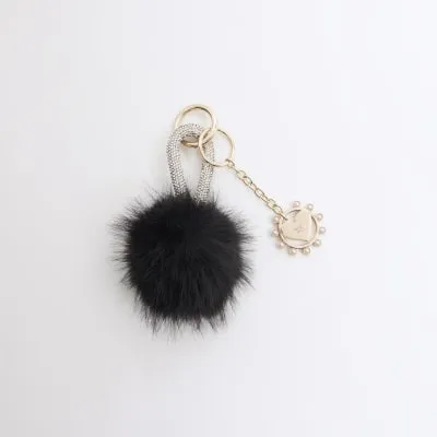 Black Pom Pom Charm sold by River Island