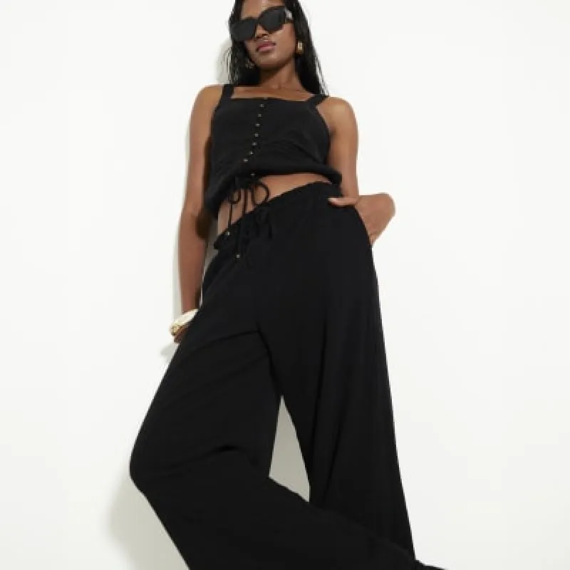 Black Crinkle Wide Leg Trousers sold by River Island