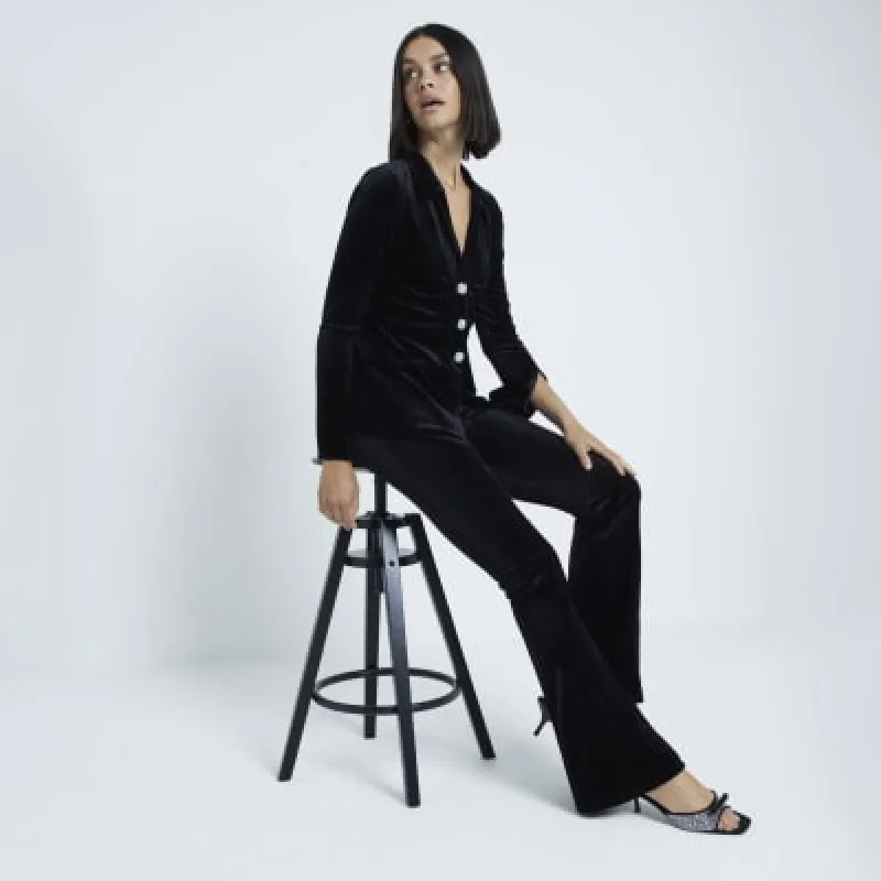 Black Velvet Bootcut Trousers sold by River Island