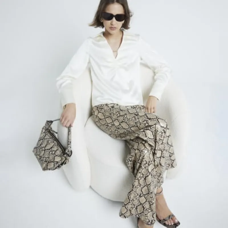 Cream Ruched Long Sleeve Blouse sold by River Island