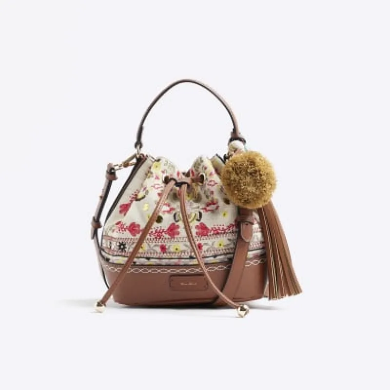 Cream Embroidered Bucket bag sold by River Island