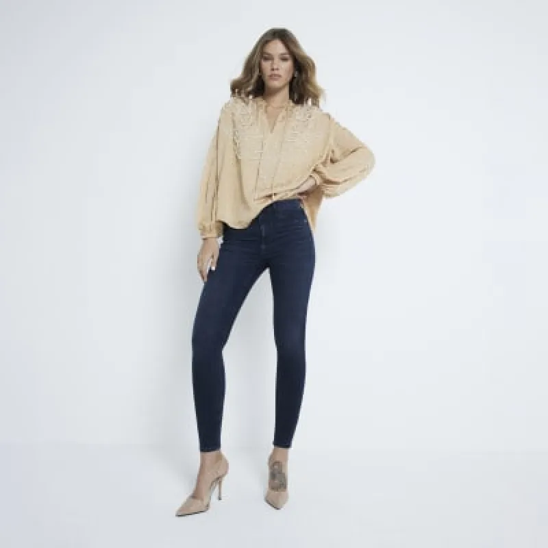 Blue denim mid rise molly sculpted jeans made by River Island