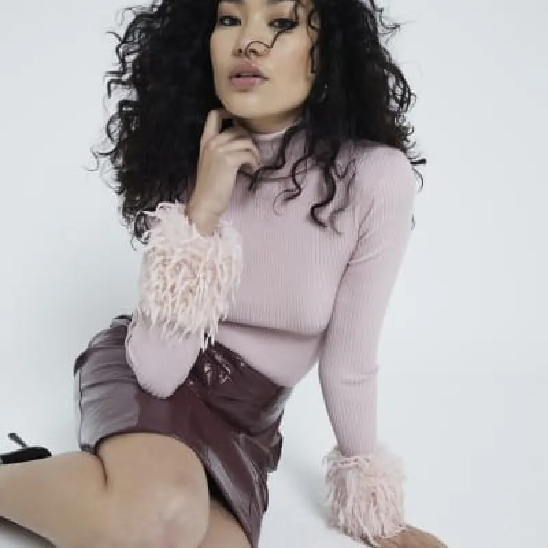 Pink Long Sleeve Feather Cuff Roll Neck Top sold by River Island
