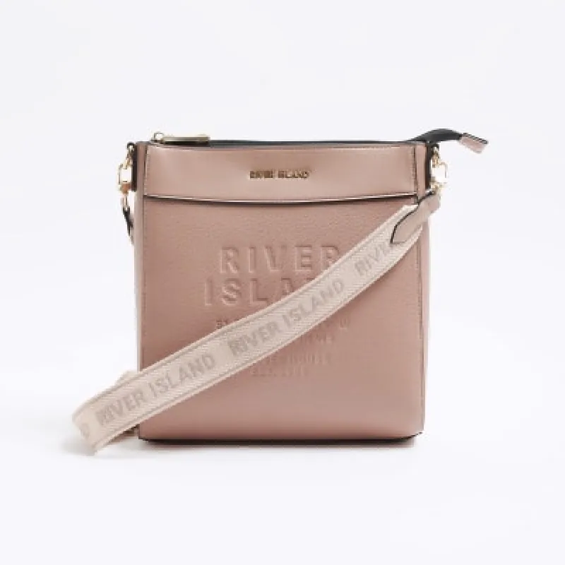 Pink RI embossed cross body bag sold by River Island