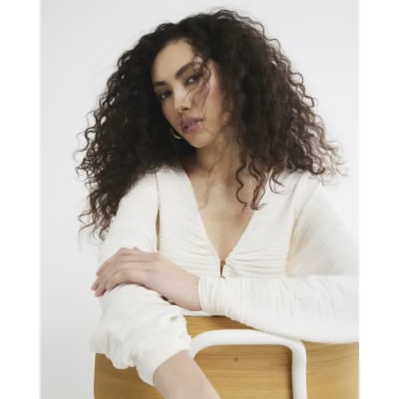 Cream Long Sleeve V-neck Plisse Top sold by River Island