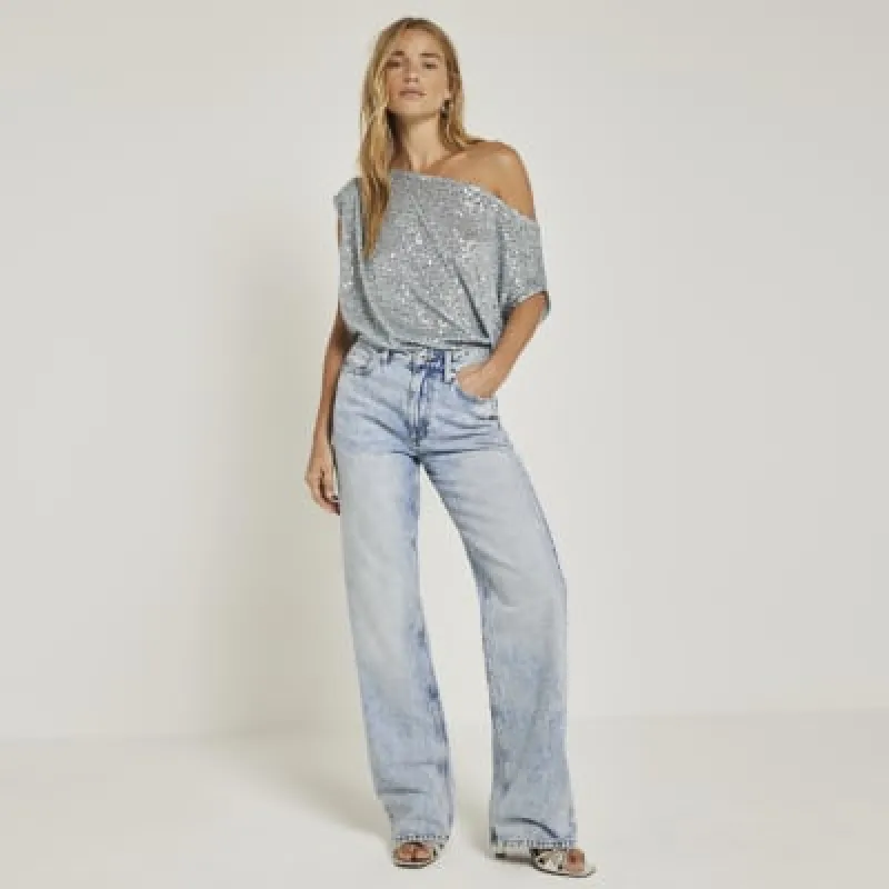 Blue sequin off shoulder top sold by River Island