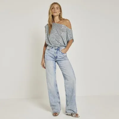 Blue sequin off shoulder top sold by River Island