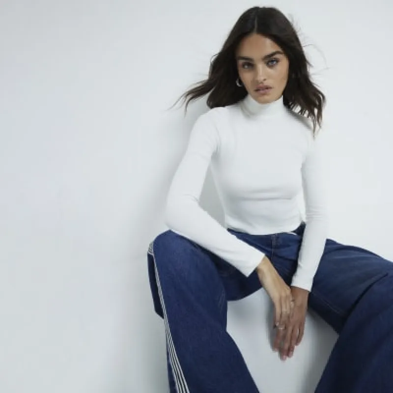 Cream Long sleeve Ribbed Turtleneck top sold by River Island