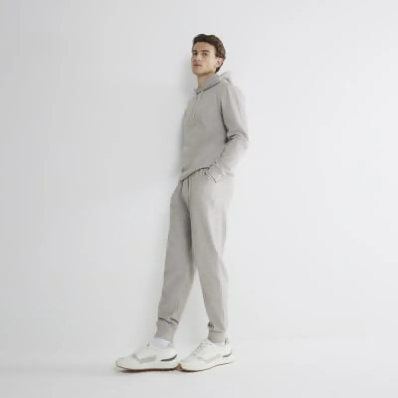 Stone Slim Fit Cuffed Joggers sold by River Island
