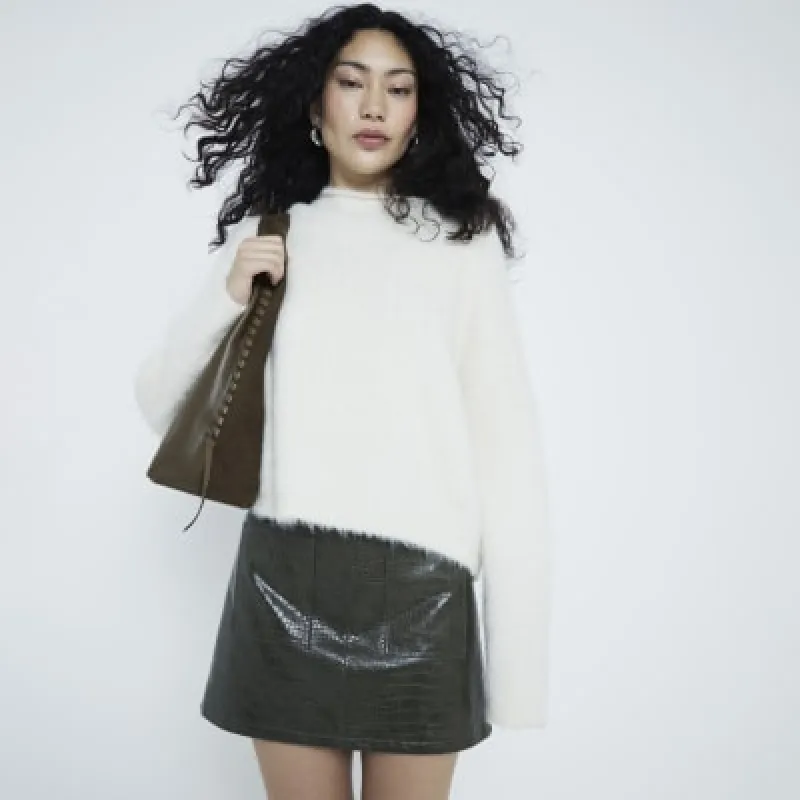 Green faux leather croc embossed mini skirt sold by River Island