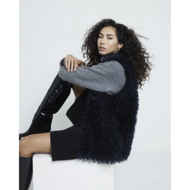 Navy Shaggy faux fur longline Gilet sold by River Island