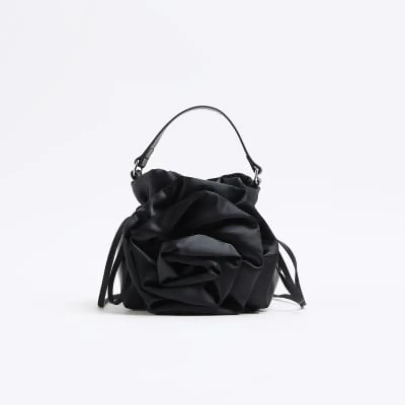 Black Satin Corsage Top Handle Bucket Bag sold by River Island