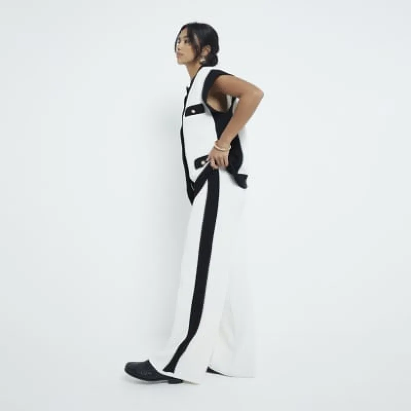 Petite Cream Tipped Wide Leg Trousers sold by River Island