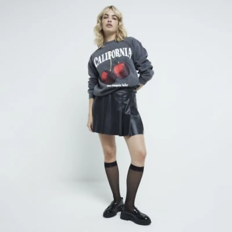 Black faux leather pleated mini skirt sold by River Island