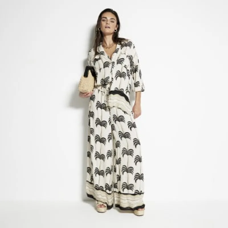 Cream Palm Print Wide Leg Beach Trousers sold by River Island
