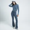 Green ribbed flared leggings sold by River Island