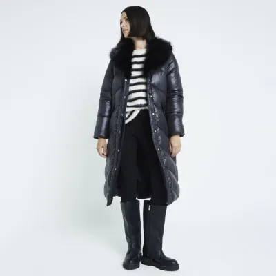 Black padded long line jacket sold by River Island