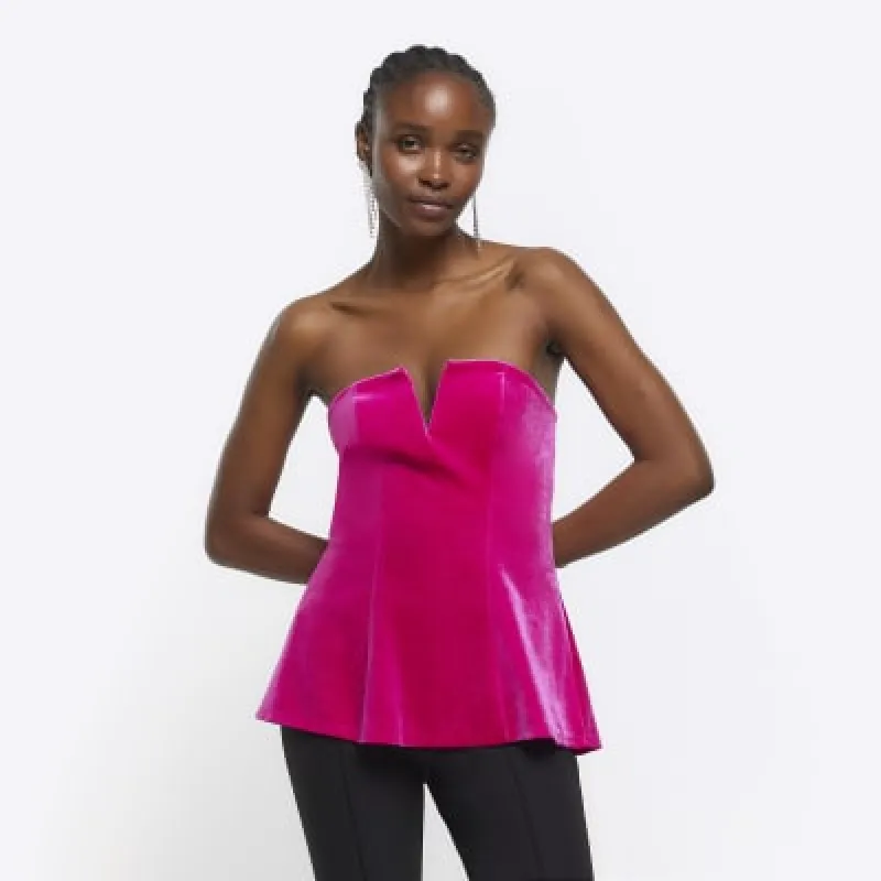 Pink velvet bandeau V neck top sold by River Island