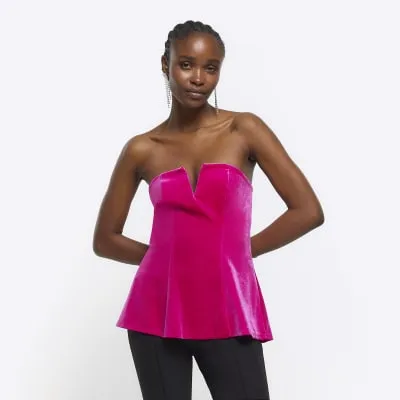 Pink velvet bandeau V neck top sold by River Island