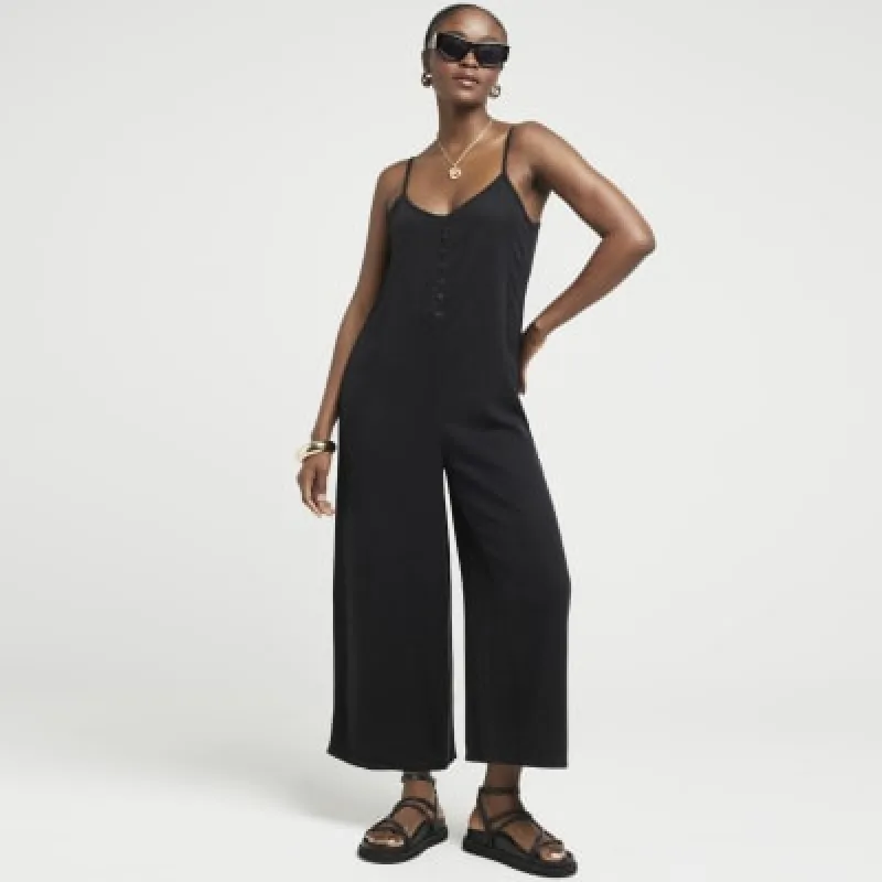 Black button up cami jumpsuit sold by River Island