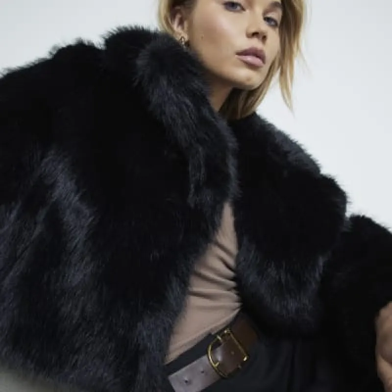 Black short plush faux fur jacket sold by River Island
