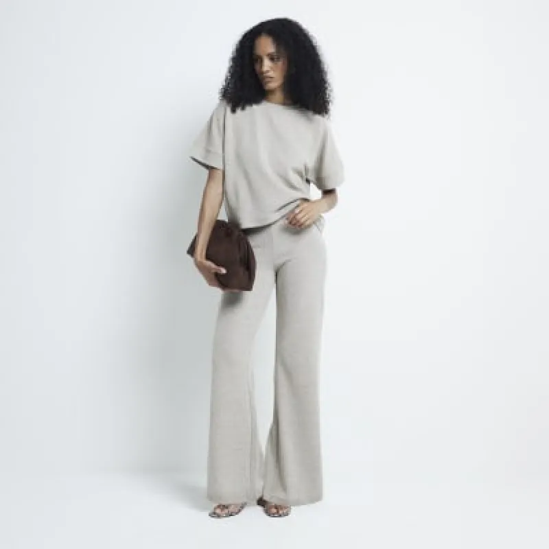 Gold metallic wide leg trousers sold by River Island