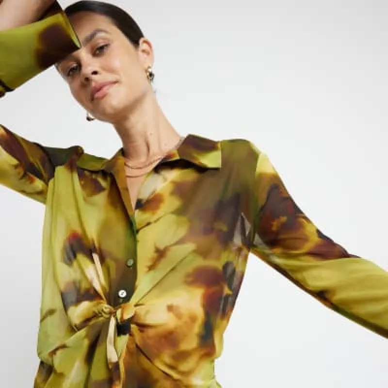 Green abstract print front knot blouse sold by River Island