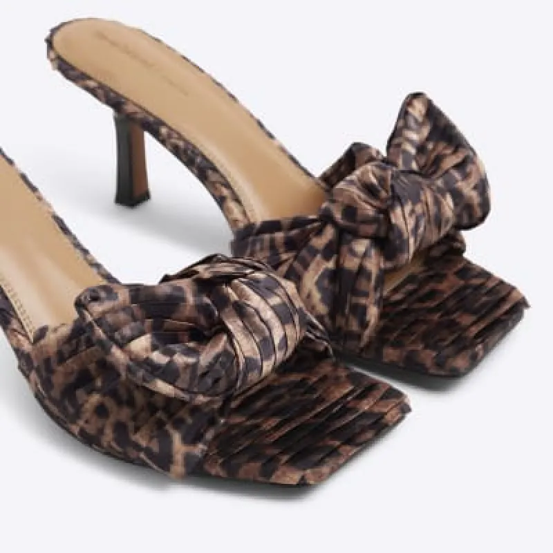 Brown ruched bow mule heeled sandals sold by River Island