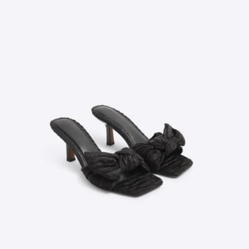 Black ruched bow mule heeled sandals sold by River Island