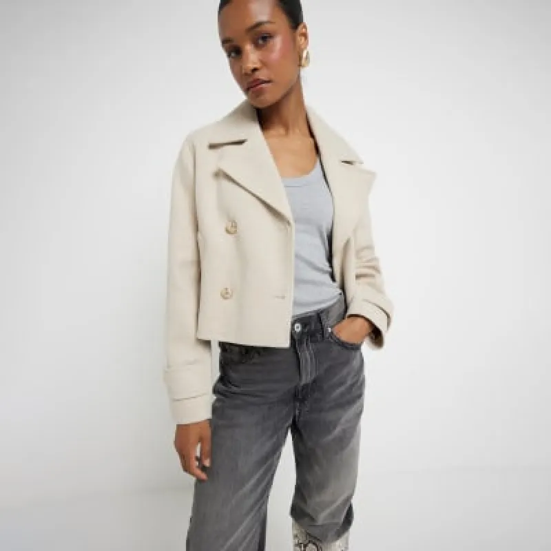 Beige cropped trench jacket sold by River Island