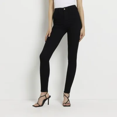 Black high waisted skinny jeans sold by River Island