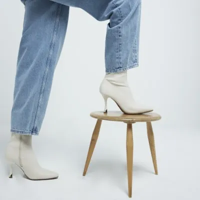 Cream Heeled Sock Boots sold by River Island