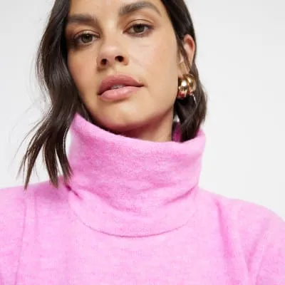 Pink knit roll neck vest top sold by River Island