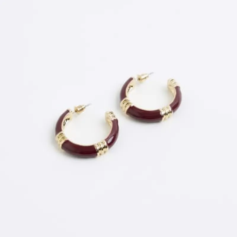 Red enamel hardware hoop earrings sold by River Island