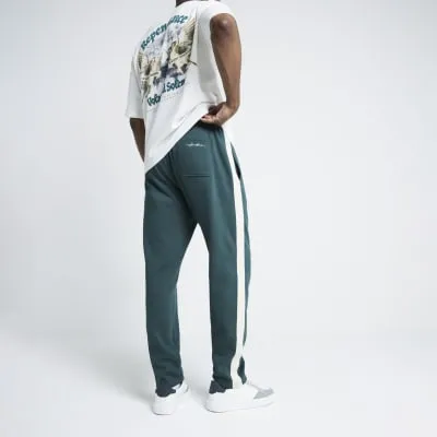 Green Regular Fit Taped Joggers sold by River Island