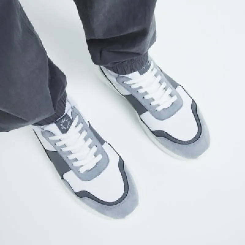 White runner trainers sold by River Island