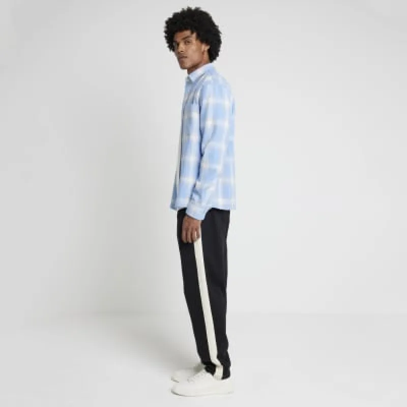 Black regular fit taped joggers sold by River Island