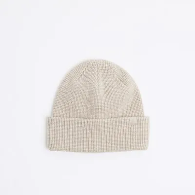 Stone waffle textured beanie sold by River Island