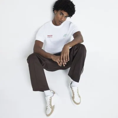 Stone leather lace up trainers sold by River Island