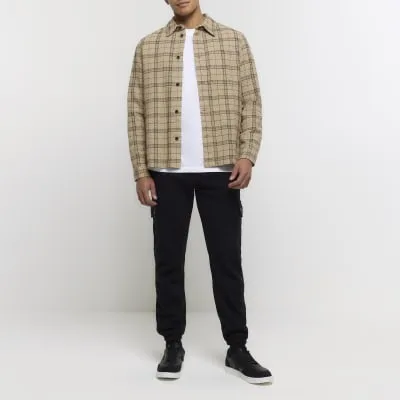 Black regular fit cargo joggers sold by River Island