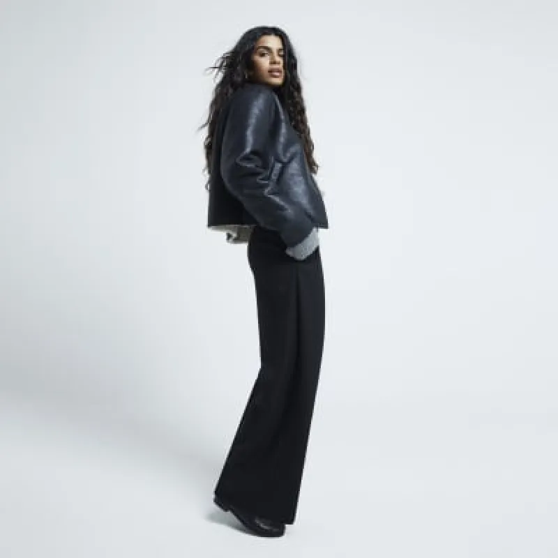 Petite Black Belted Wide Leg Trousers sold by River Island