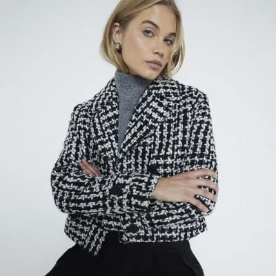 Black monochrome boucle textured crop jacket sold by River Island