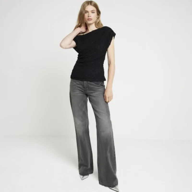 Black lace drape asymmetric top sold by River Island