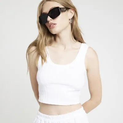 White ribbed scoop neck crop tank top sold by River Island