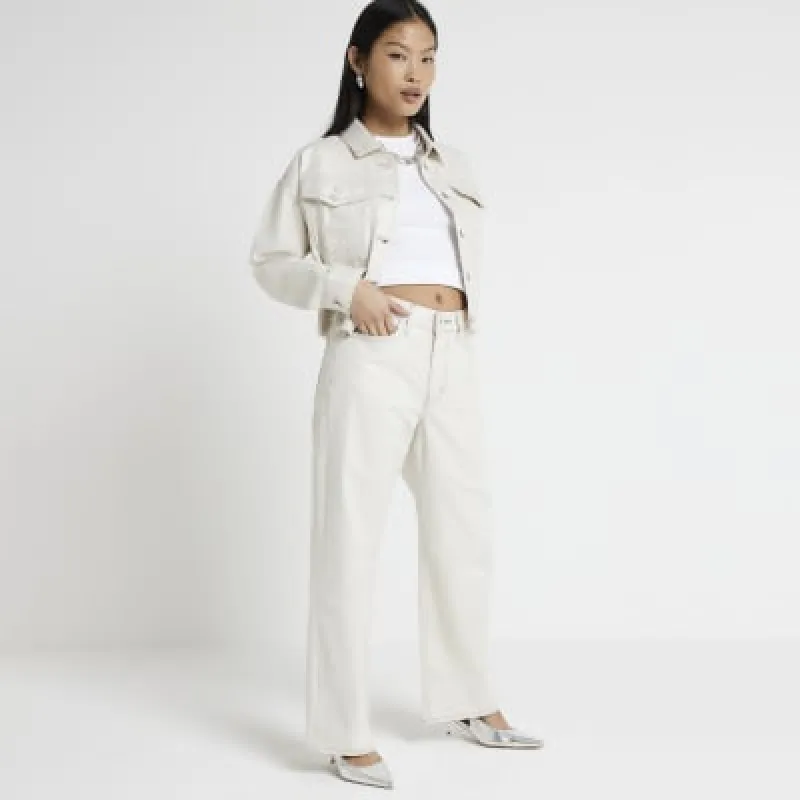 Petite Cream low rise straight fit jeans sold by River Island