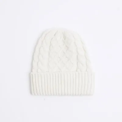 Beige chunky cable knit beanie hat sold by River Island