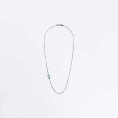 Silver marble cross necklace sold by River Island