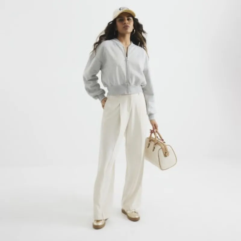 Petite Cream Wide Leg Trousers sold by River Island