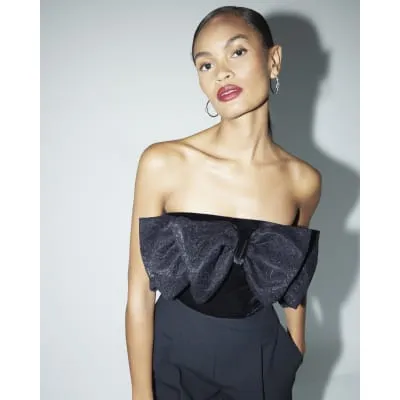 Black lace bow velvet bandeau bodysuit sold by River Island