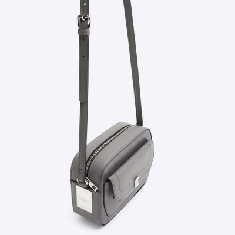 Grey faux leather cross body bag sold by River Island